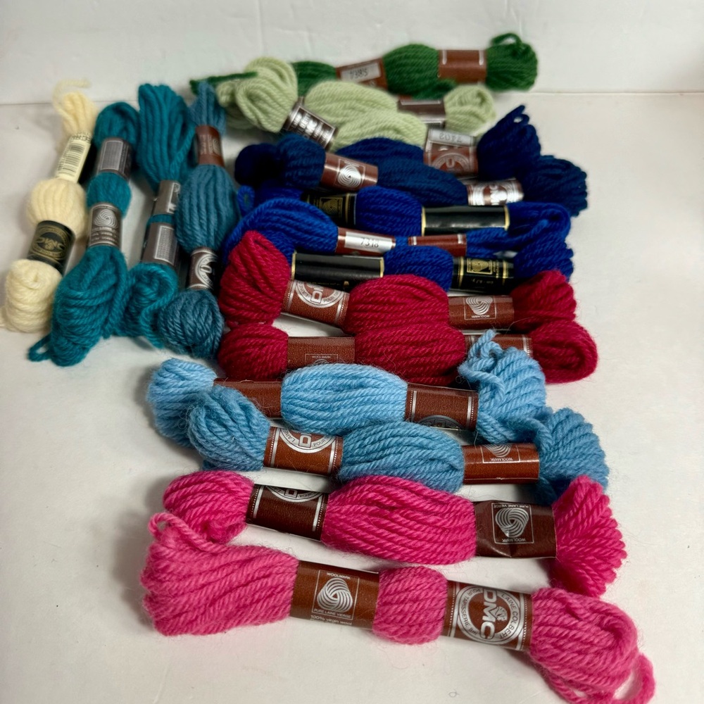 Multiple small skeins of wool yarn. DMC Tapestry Wool Yarn.
